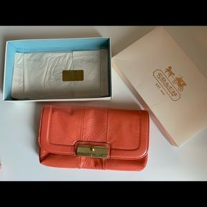 Coach patent leather coral wristlet